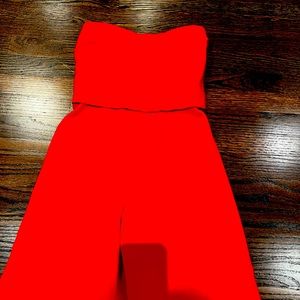 Strapless wide legged jumpsuit with open back and sexy strap closure